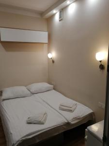 Posteľ alebo postele v izbe v ubytovaní R&B APARTMENTS POZNAŃ