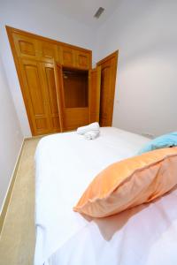 Posteľ alebo postele v izbe v ubytovaní Patio Rialto Apartment