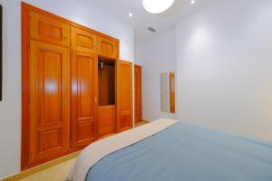 Posteľ alebo postele v izbe v ubytovaní Patio Rialto Apartment