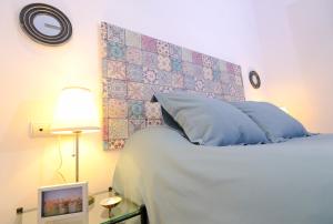 Posteľ alebo postele v izbe v ubytovaní Patio Rialto Apartment