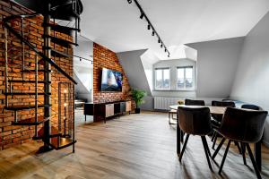 Televízia a/alebo spoločenská miestnosť v ubytovaní BanApart Exclusive Apartments