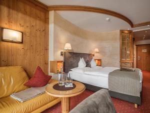 En eller flere senge i et værelse på Rieser Achensee Resort