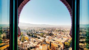 a view of a city from a window at Alhambra Palace in Granada