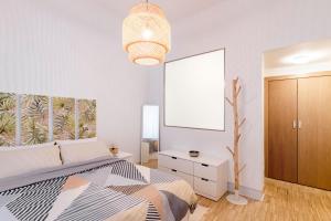 Łóżko lub łóżka w pokoju w obiekcie Plaza Mayor Apartment