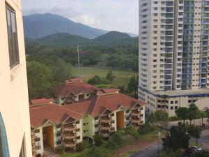 an aerial view of a building and a tall building at D Savoy 3 Bedroom Condo within Famosa Resort in Kampong Alor Gajah