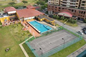 an overhead view of a tennis court with a tennis court at D Savoy 3 Bedroom Condo within Famosa Resort in Kampong Alor Gajah