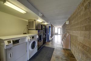a laundry room with a washer and dryer at Motel 6-San Antonio, TX - Downtown - Market Square in San Antonio