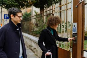 two people are looking at a parking meter at Dadi Home in Padova