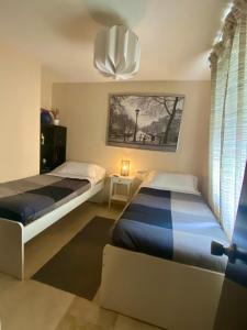 A bed or beds in a room at Plaza de San Francisco