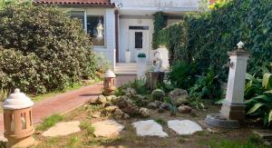 a house with three fire hydrants in the yard at Carolina’S Nest in Casal Palocco