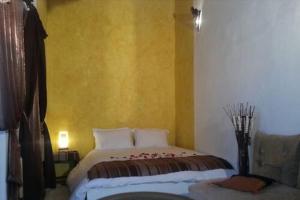 Cama o camas de una habitación en Riad El Bir