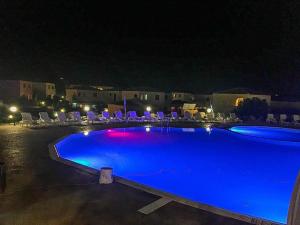 Bazén v ubytování Casa bouganville Vignola Mare nebo v jeho okolí