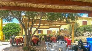 Restaurace v ubytování Casa bouganville Vignola Mare