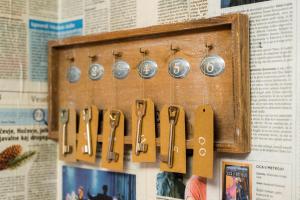 a bunch of clocks hanging on a wall at Bah Apartment in Ljubljana