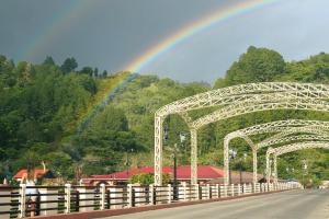 a rainbow over a bridge with a rainbow at ONDA Boquete - En Desarrollo in Boquete