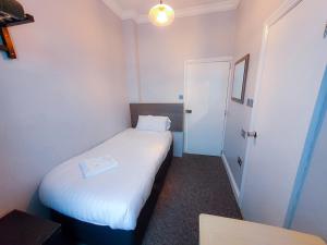Postel nebo postele na pokoji v ubytování Plaza Hotel
