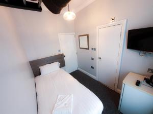 Postel nebo postele na pokoji v ubytování Plaza Hotel