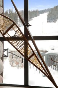 a view of a ski slope from a window at Sundance Lodge in Sun Peaks