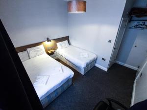 Postel nebo postele na pokoji v ubytování Plaza Hotel