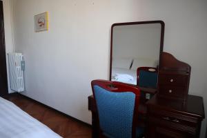 Letto o letti in una camera di b&b Wu Giada