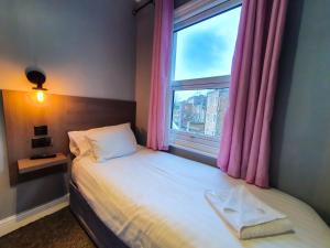 Postel nebo postele na pokoji v ubytování Plaza Hotel