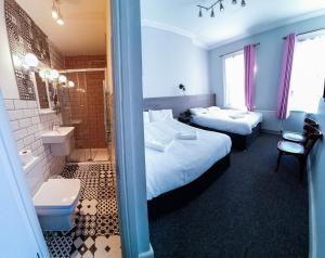 Postel nebo postele na pokoji v ubytování Plaza Hotel