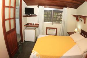 
A bed or beds in a room at POUSADA VIVENDAS DO MORRO VERDE
