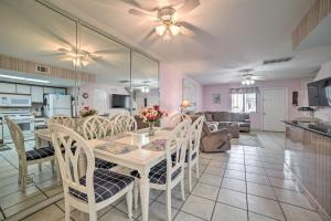 a dining room and kitchen with a table and chairs at Panama City Beach Townhome - Walk to Beach! in Panama City Beach