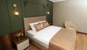 Voodi või voodid majutusasutuse Bayrak Grand Hotel toas
