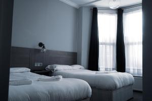 Postel nebo postele na pokoji v ubytování Plaza Hotel