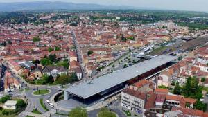 an aerial view of a city with a train station at CHOUETTISSIME Topséjour-Roanne 1 chambre All Inclusive in Roanne
