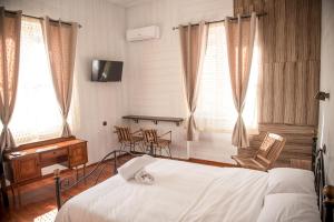 Posteľ alebo postele v izbe v ubytovaní 1920s Rooms