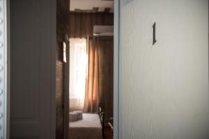 Posteľ alebo postele v izbe v ubytovaní 1920s Rooms