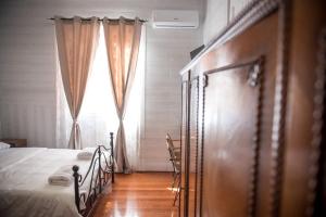 Posteľ alebo postele v izbe v ubytovaní 1920s Rooms