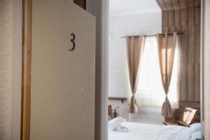 Posteľ alebo postele v izbe v ubytovaní 1920s Rooms