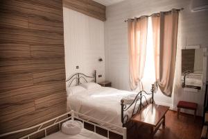 Posteľ alebo postele v izbe v ubytovaní 1920s Rooms