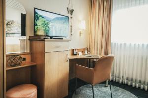 TV a/nebo společenská místnost v ubytování Hotel Koch