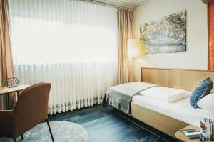 Postel nebo postele na pokoji v ubytování Hotel Koch