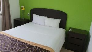 Postel nebo postele na pokoji v ubytování Nirvana Hotel - Cancun Hotel Zone