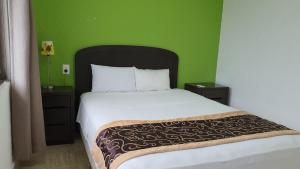 Cama o camas de una habitación en Nirvana Hotel - Cancun Hotel Zone