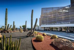 a display of cacti in front of a building at Barceló Lanzarote Royal Level in Costa Teguise