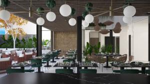 a restaurant with tables and green chairs and lights at M. HOTEL in San Antonio
