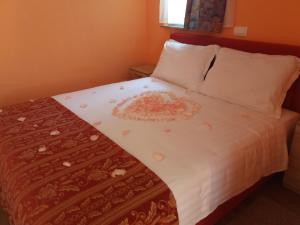 Postel nebo postele na pokoji v ubytování Apartments Rale