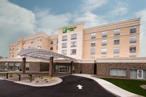 a rendering of a hotel with a building at Holiday Inn & Suites Detroit - Troy, an IHG Hotel in Troy