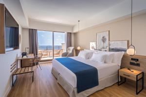 A bed or beds in a room at Barceló Lanzarote Royal Level