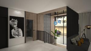 a living room with a black and white photo on the wall at M. HOTEL in San Antonio