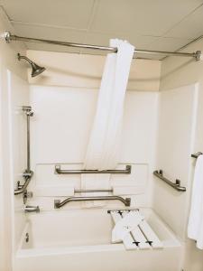 a bathroom with a white sink and towels at Quality Inn & Suites Clemmons I-40 in Clemmons