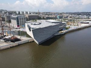 a building next to a body of water at Bright & Stylish Apartment in Dundee