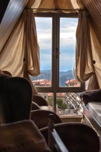 a view of a city from a window at Lykovrisi Guest House in Arachova