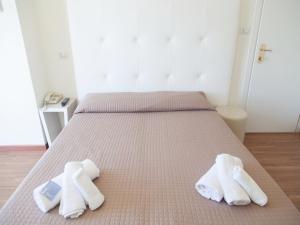 Postel nebo postele na pokoji v ubytování Riviera Mare Beach Life Hotel
